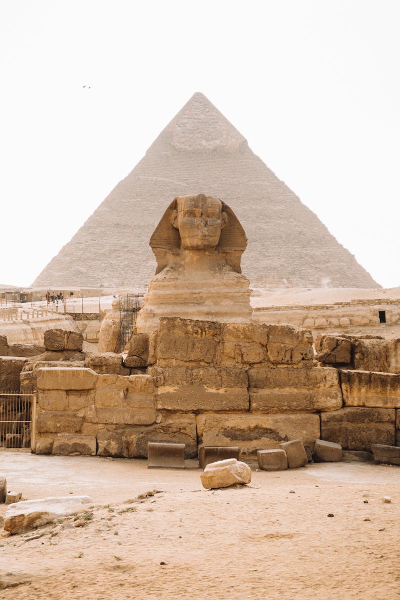 Iconic view of the Sphinx with the Pyramid of Khafre in Giza, Egypt.