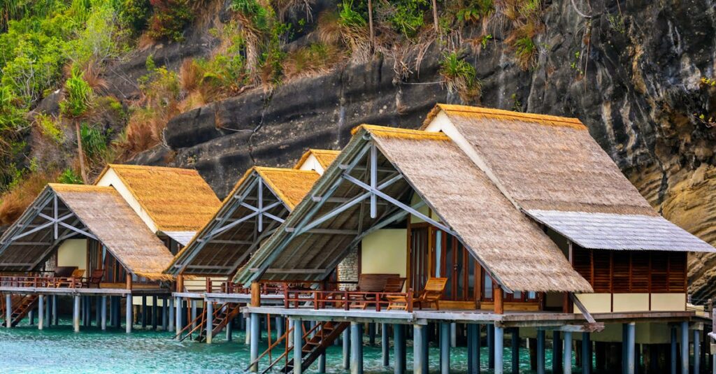 Beautiful overwater bungalows in Raja Ampat, Indonesia, surrounded by stunning nature.
